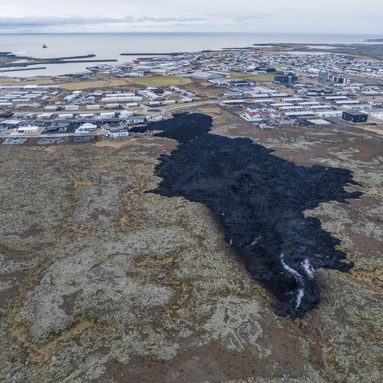 Iceland faces daunting period after lava from volcano destroys homes in fishing town, president says